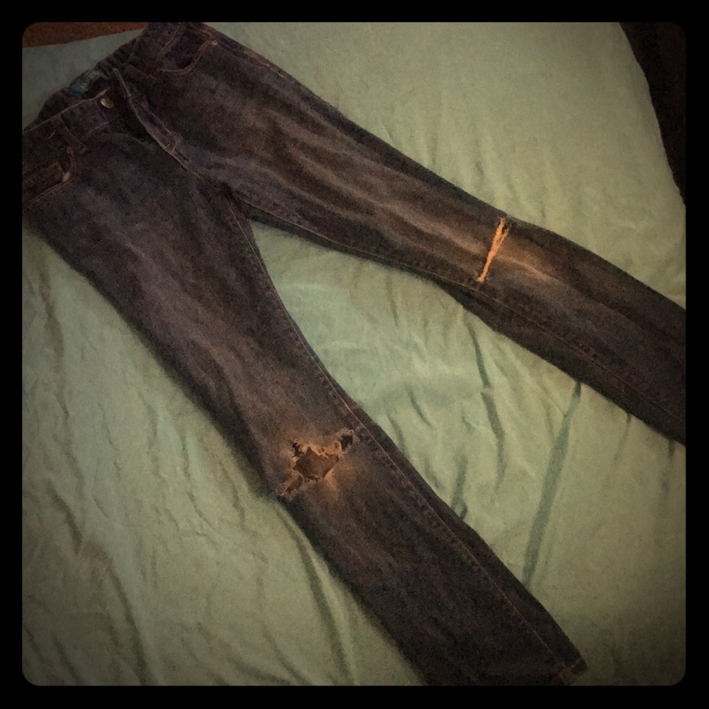 Used skinny jeans with holes in knees